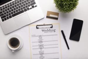 Wedding Planning text written on a clipboard, credit card
